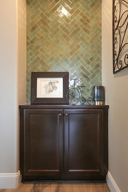Herringbone tile niche and cabinet detail in the Family Living home