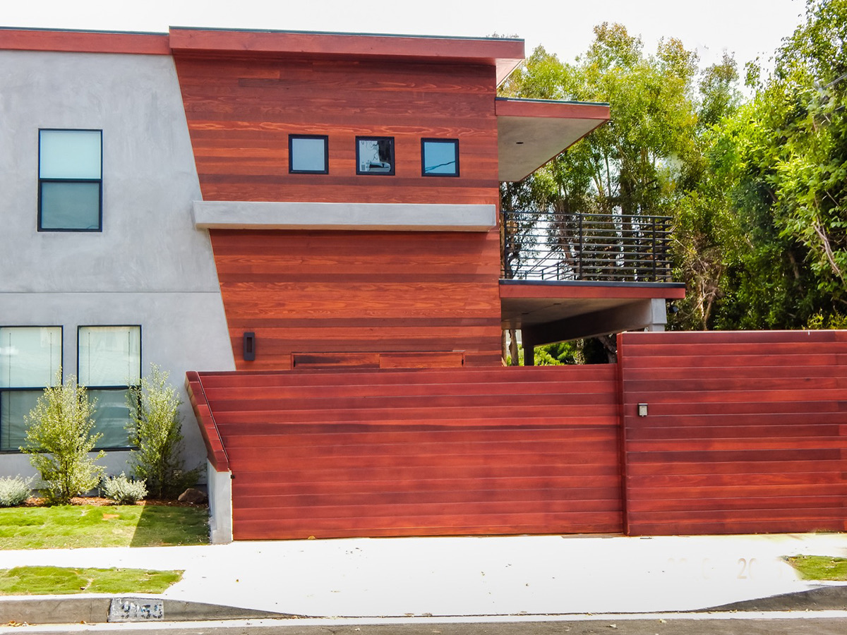 Redwood and concrete modern home exterior by Fassino Construction
