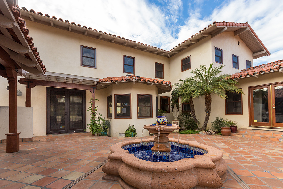 Courtyard and fountain of the Mediterranean Soul custom home by Fassino Construction
