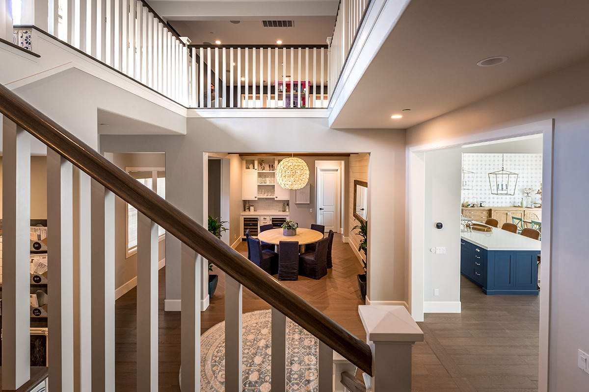 Stair hall opening to the dining room in the Modern Country home