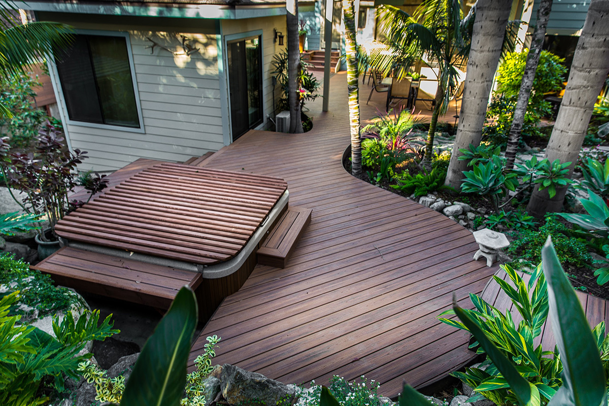 Winding hardwood deck and spa of the Tropical Zen custom home